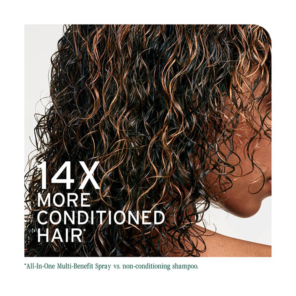 Close-up of curly hair with text about conditioned hair and a brand name.