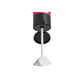 Black and pink cylindrical device with a white string and foam ball on a white background