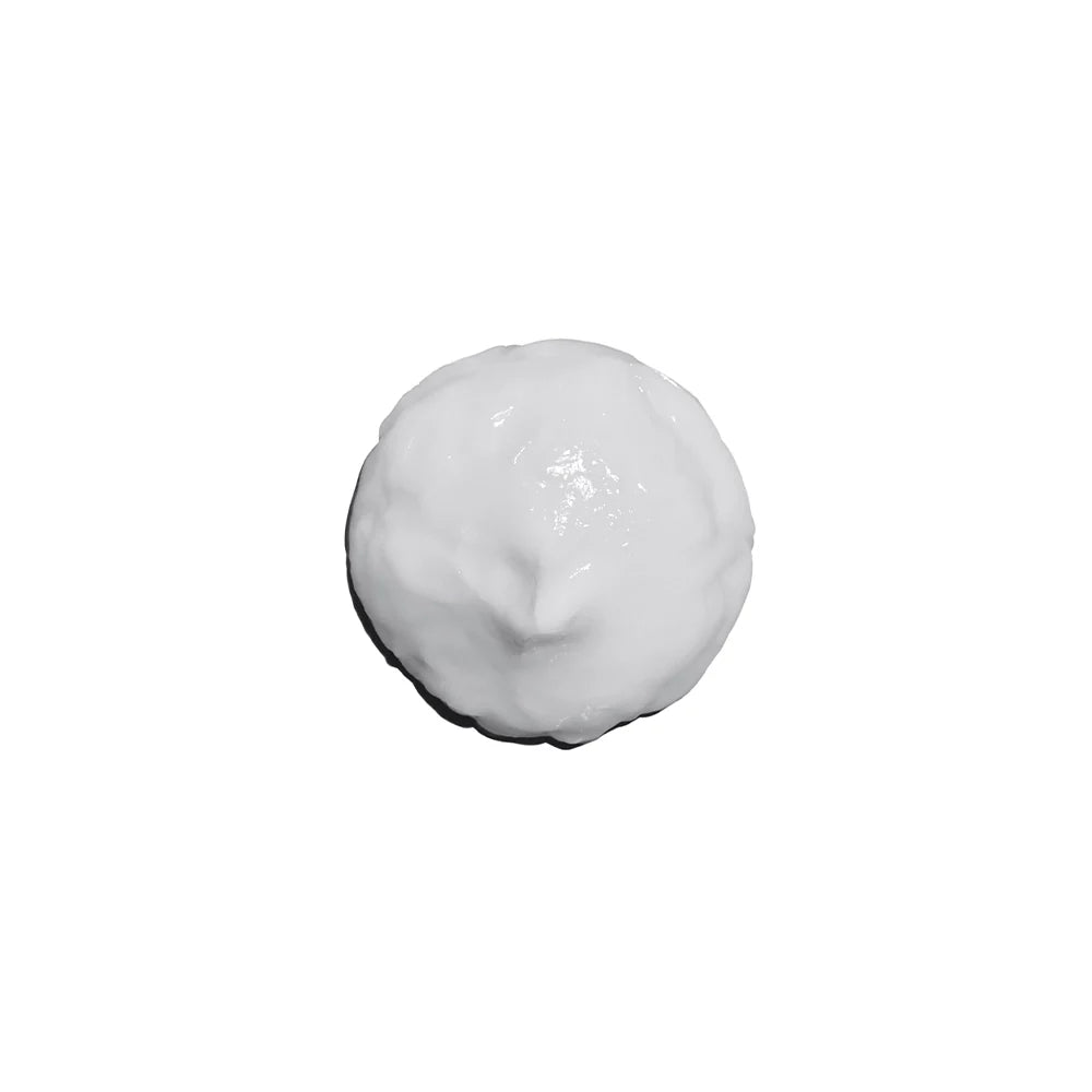 White cream or paste on a white background