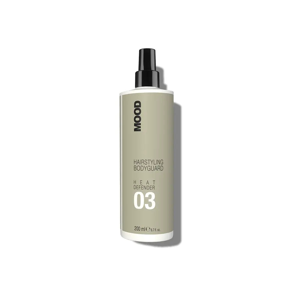 A bottle of MOOD 03 Heat Defender hair styling product.